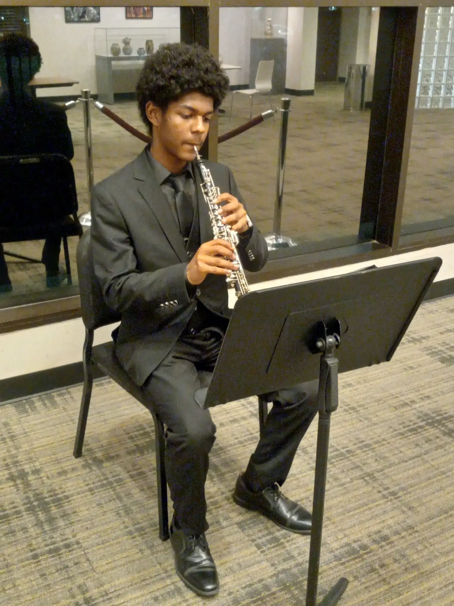 11-16-2024 - Prelude 7a - Nuriel Guevara (posed, playing oboe, other angle) (cropped)